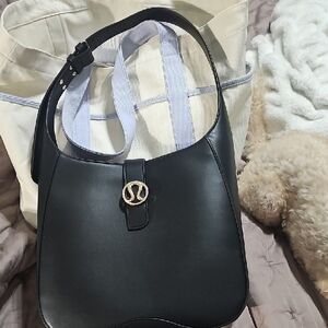 lululemon athletica Black Shoulder Bag with Gold Logo Accent